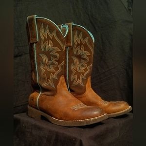 Brown and lined teal trim boots